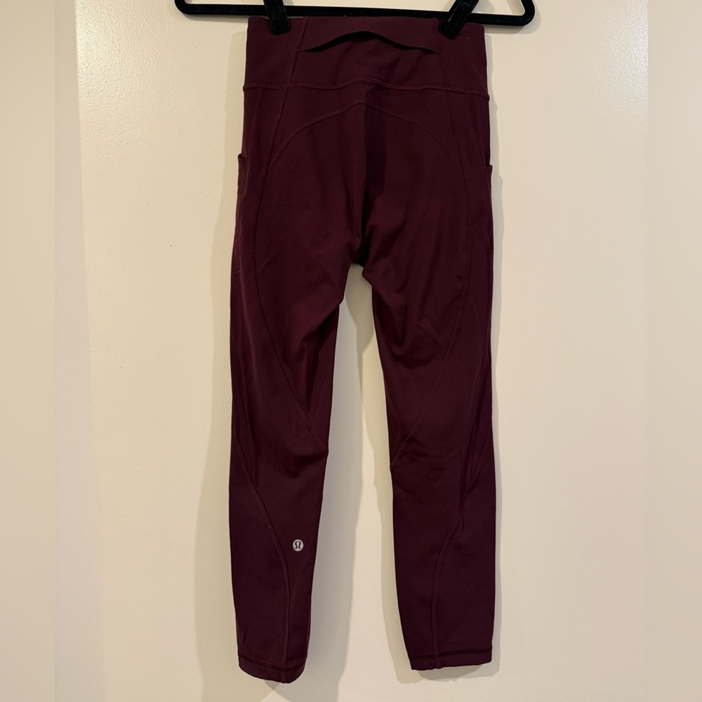 Dark red Lululemon pocketed leggings sz 4